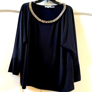 Extra large Calvin Klein women’s blouse with a gold chain accent.